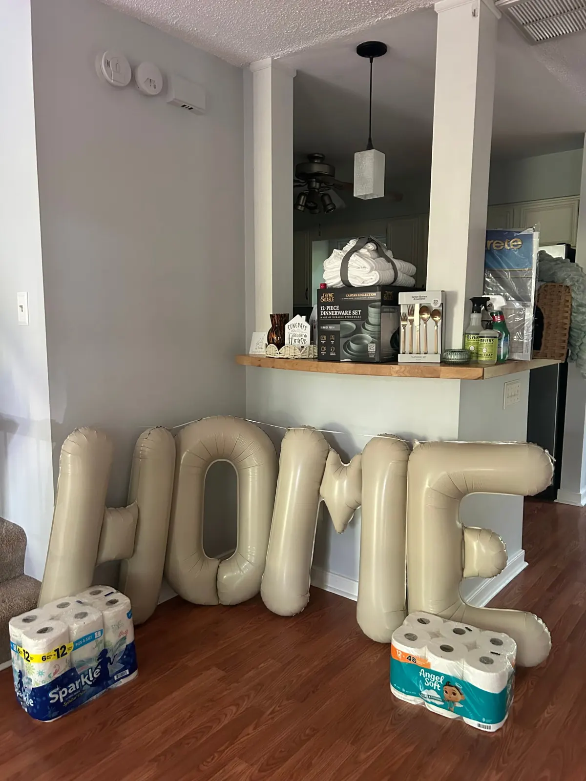 HOME balloons and housewarming gifts set up for a client on closing day