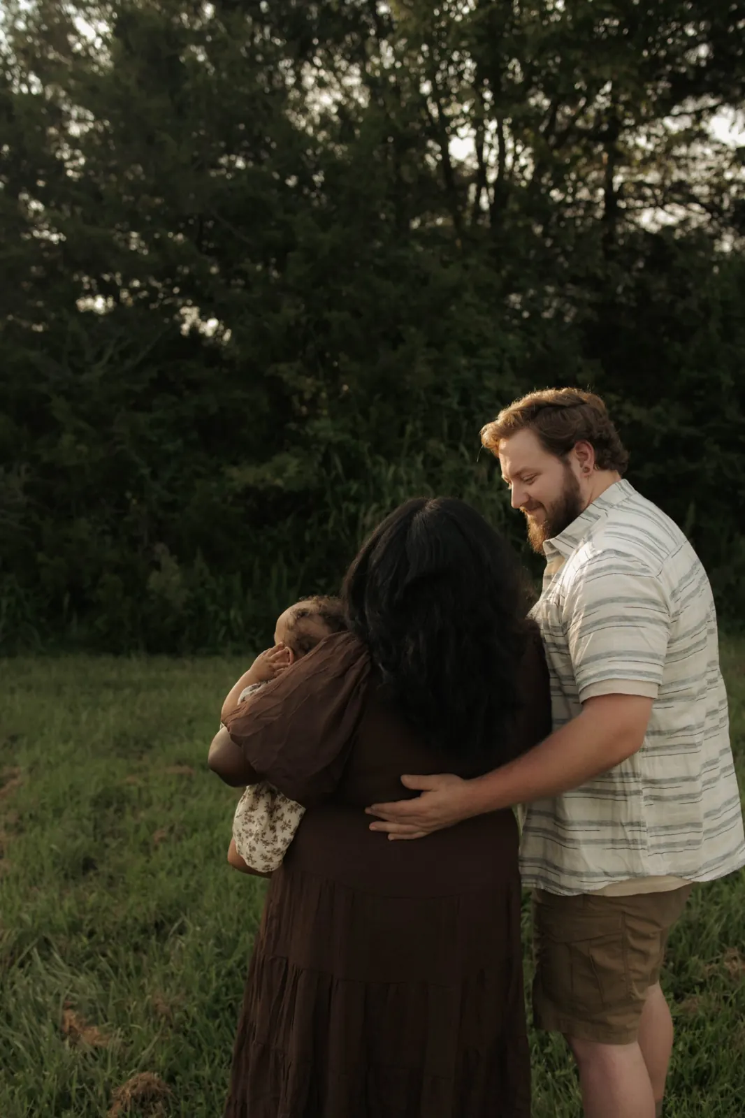 Family in an open green field in rural Central Virginia