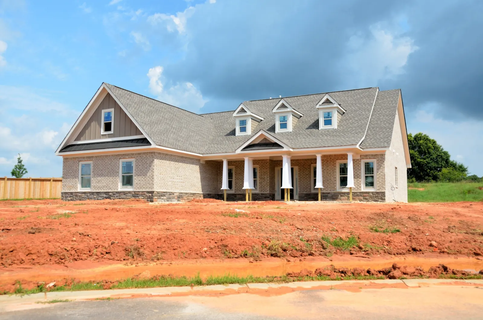 Brand-new brick ranch home with a covered front porch, just finished by the builder